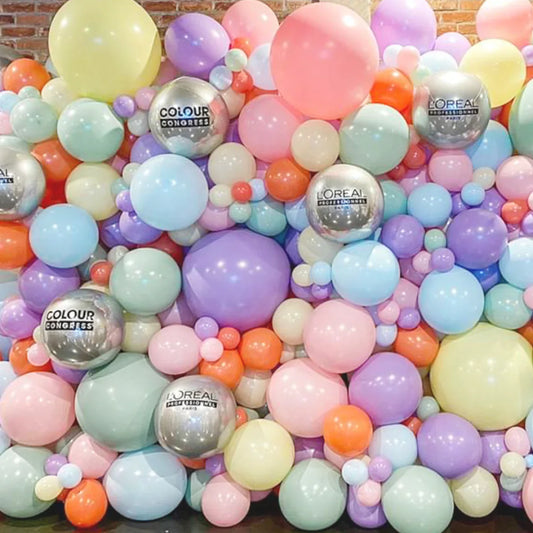 Colorful pastel balloon wall with L'Oréal Professionnel and Colour Congress silver balloons