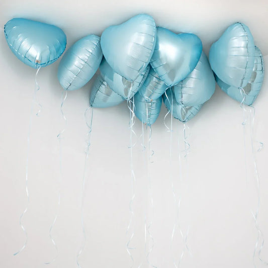 Baby blue heart foil helium ceiling balloons with ribbons against a white background