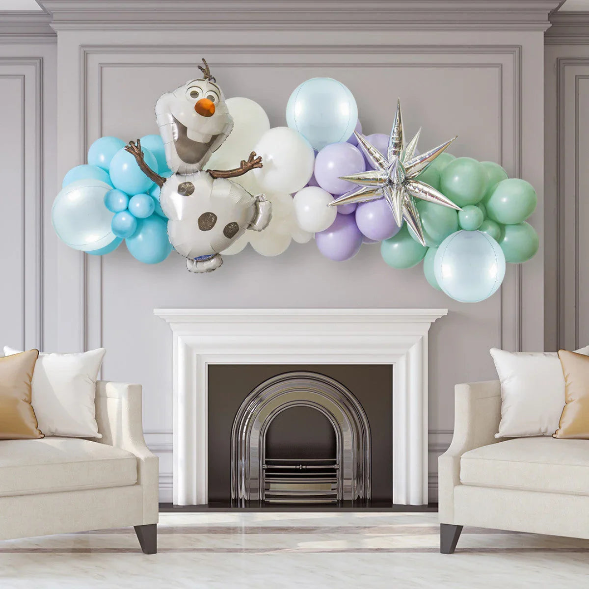 Frozen-themed balloon garland with Olaf and star balloon above fireplace in elegant living room