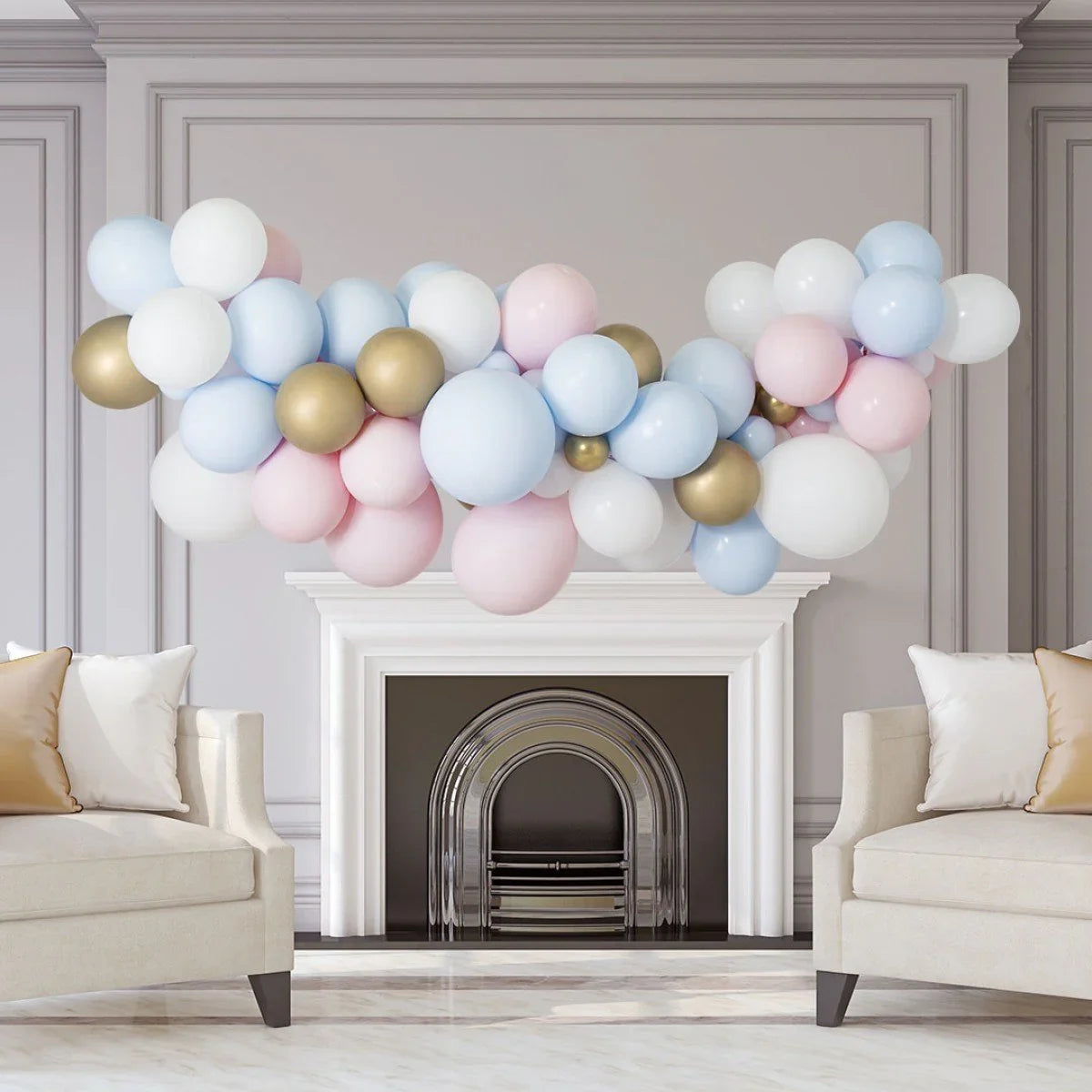 Pastel balloon garland in pink, blue, white, and gold decorating white fireplace mantel in elegant living room