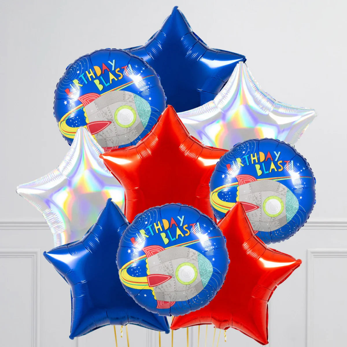 Colorful birthday blast foil balloons featuring rocket and star shapes in blue, red, and silver