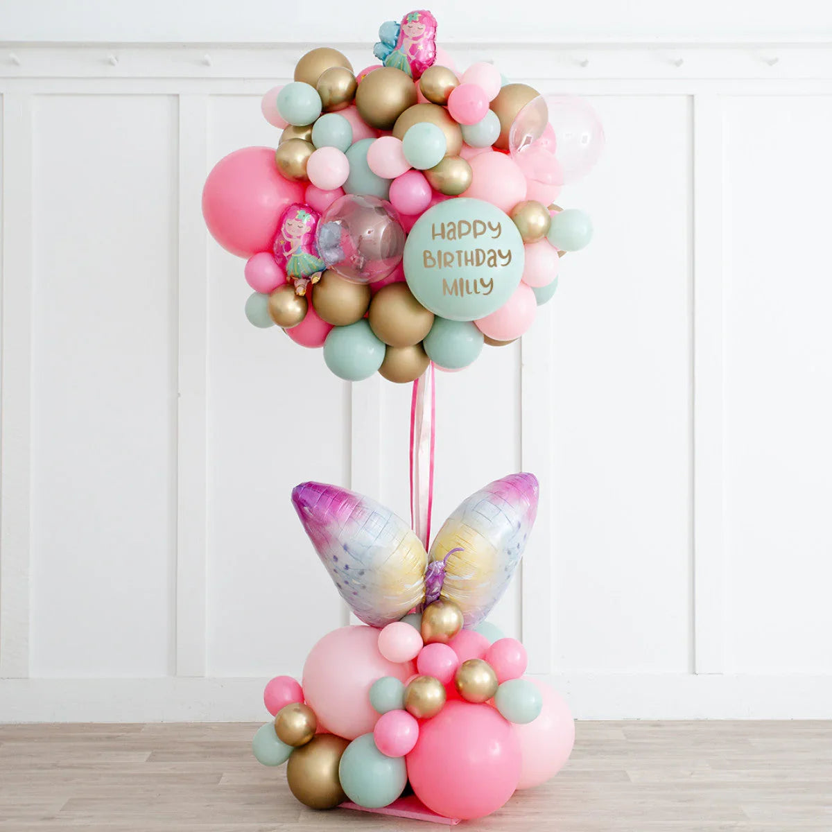 Butterfly fairy hot air balloon birthday display with pastel and gold balloons, Dubai decor