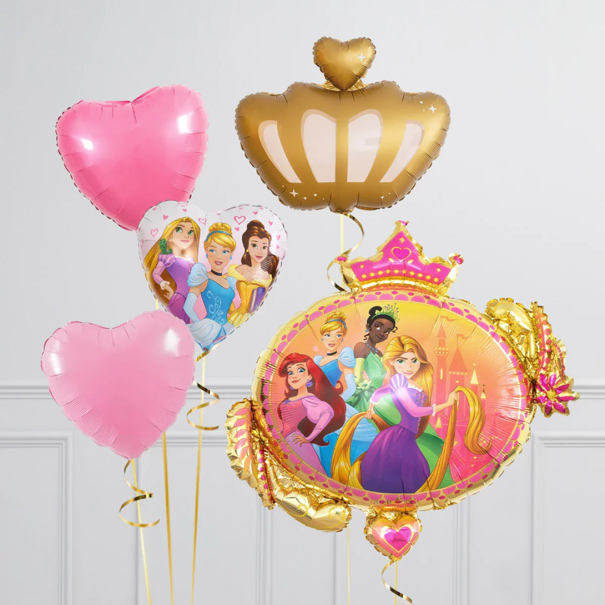 Disney Princess themed balloon bouquet featuring Rapunzel, Cinderella, Ariel, Tiana and Belle with pink heart and gold crown balloons