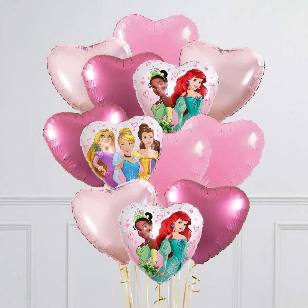 Bouquet of pink heart-shaped balloons featuring Disney princesses Ariel, Tiana, Cinderella, Belle, and Rapunzel