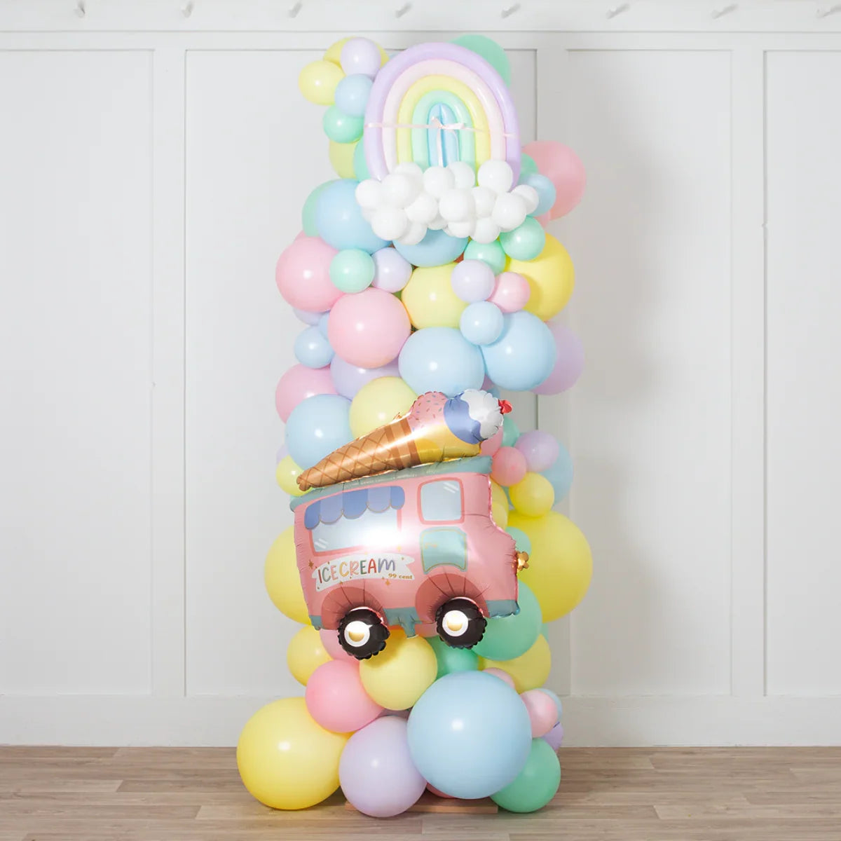 Pastel balloon pillar with rainbow and ice cream truck foil balloons, party decoration