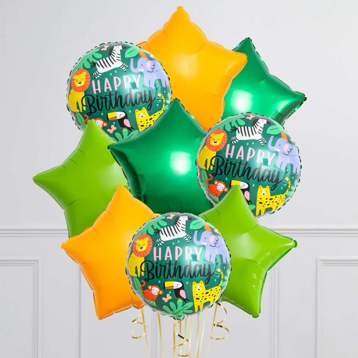 Jungle-themed Happy Birthday foil balloons with green and orange star-shaped balloons