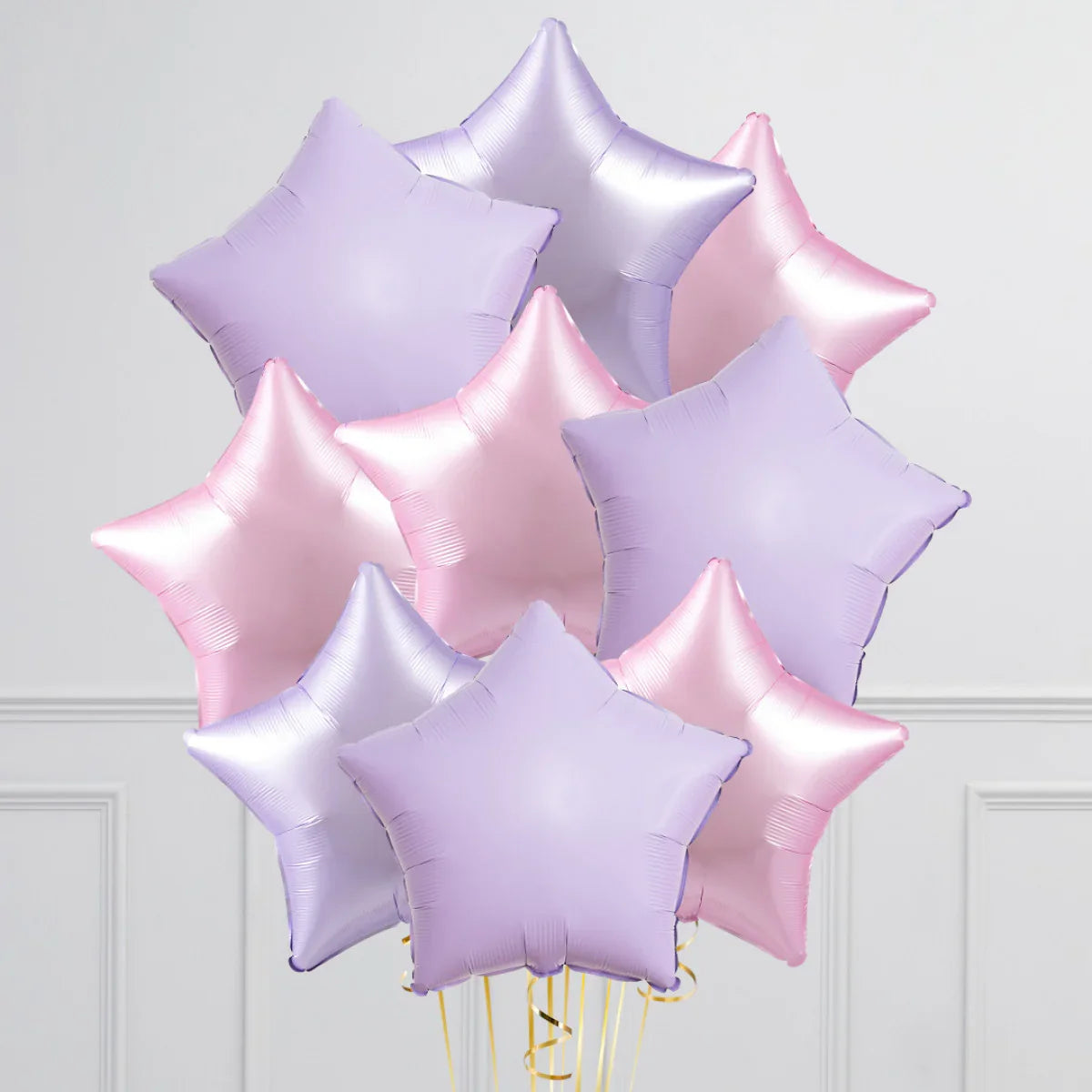 Lavender and pink star-shaped foil balloon bunch for party decorations