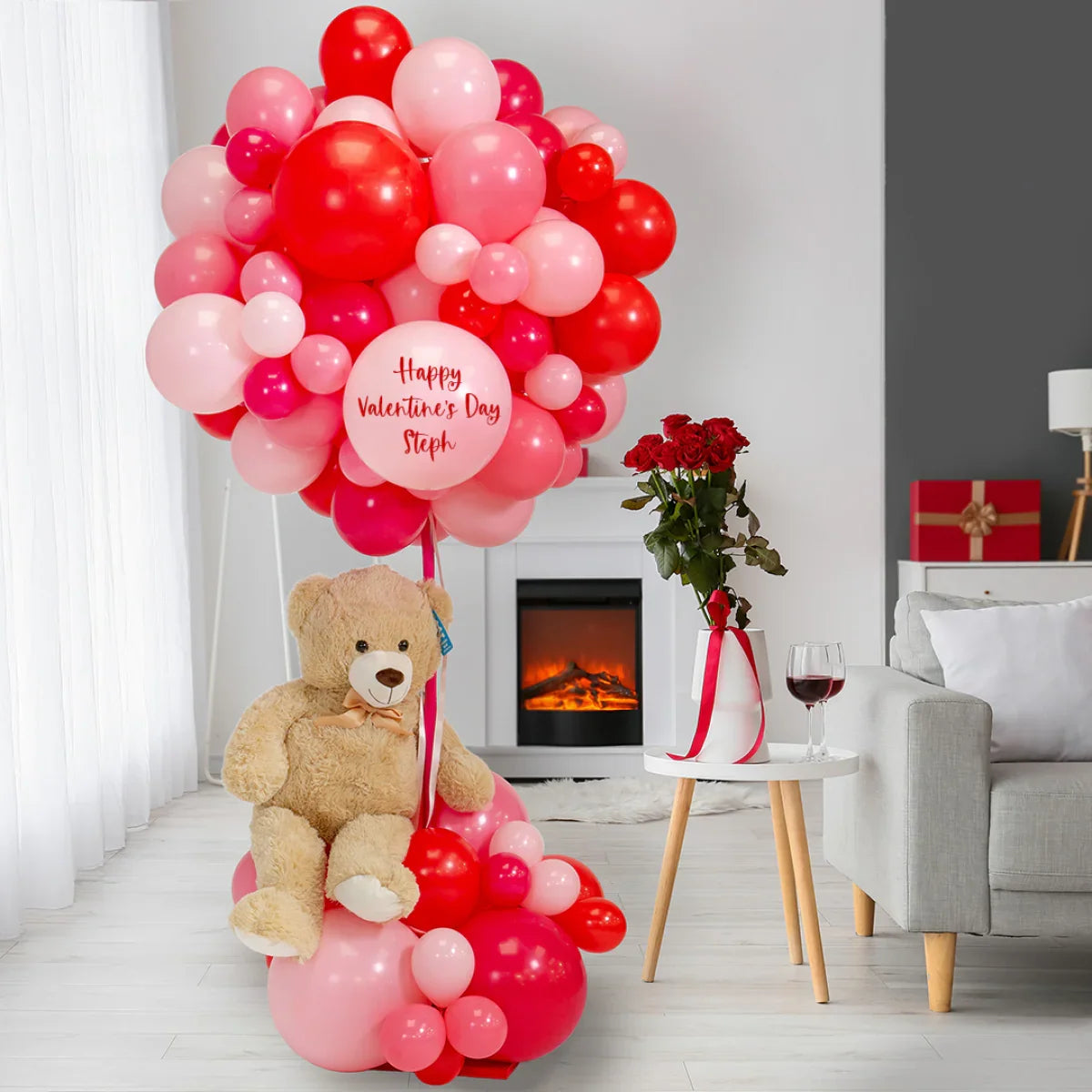 Personalised Valentine's Day hot air balloon display with teddy bear in modern Dubai living room