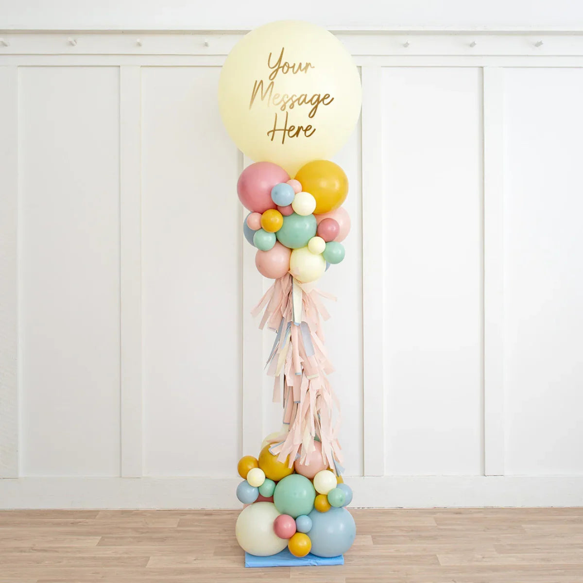 Personalised pastel balloon pillar with customizable message and tassel decor for party decoration