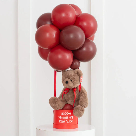 Personalized Valentine's Day gift with brown teddy bear and red hot air balloon display