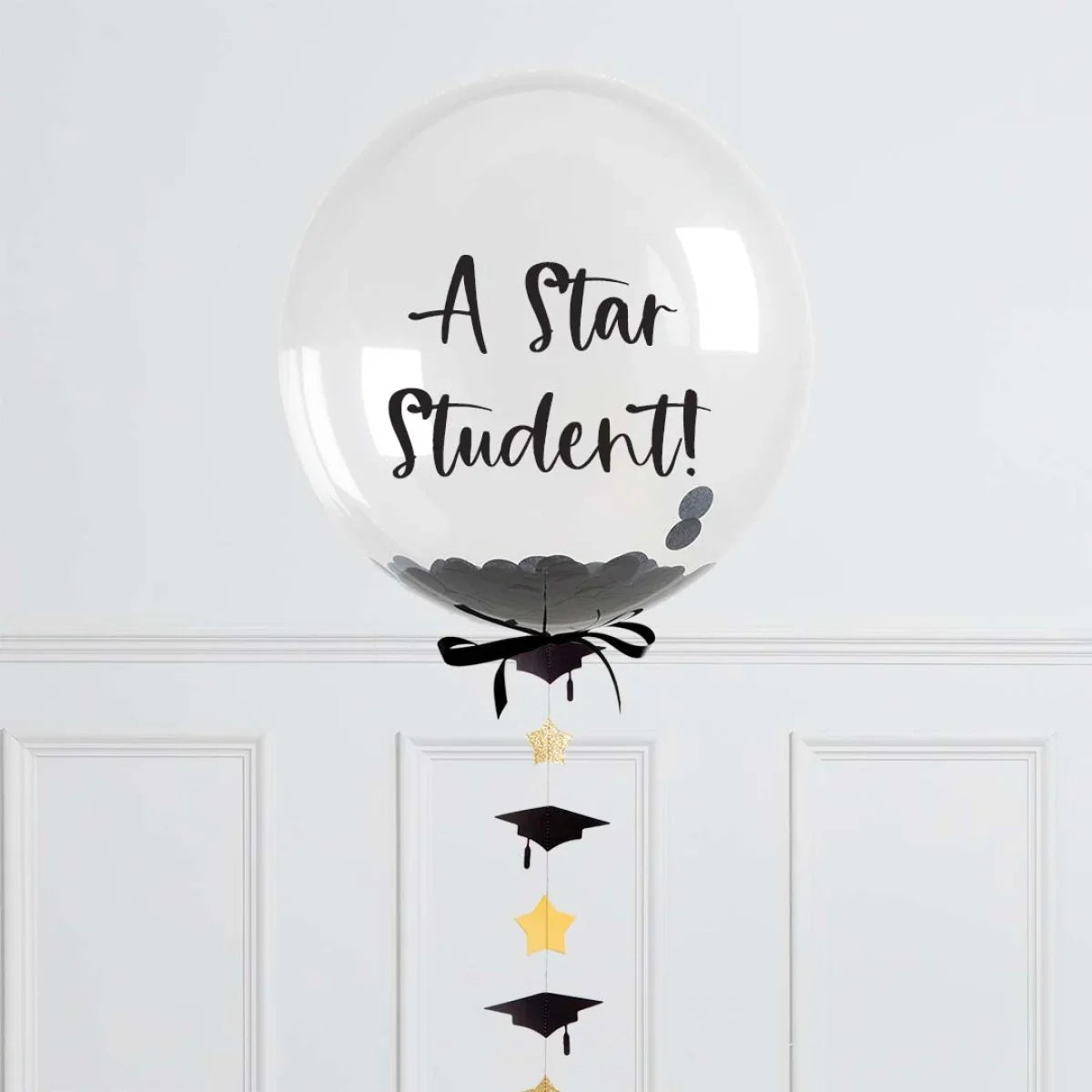 Personalized graduation confetti bubble balloon with 'A Star Student!' text, gold stars and black caps.