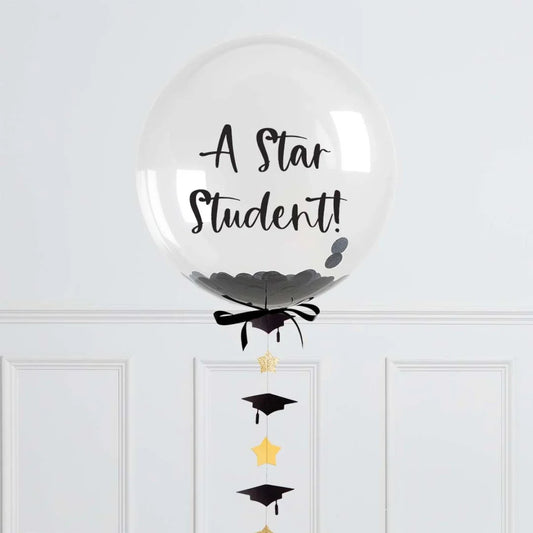 Personalized graduation confetti bubble balloon with 'A Star Student!' text, gold stars and black caps.