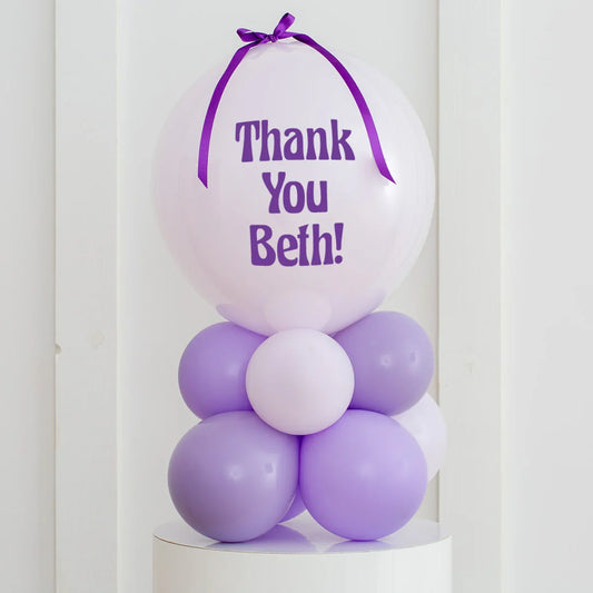 Personalized lavender bubble balloon stack with 'Thank You Beth!' text in Dubai