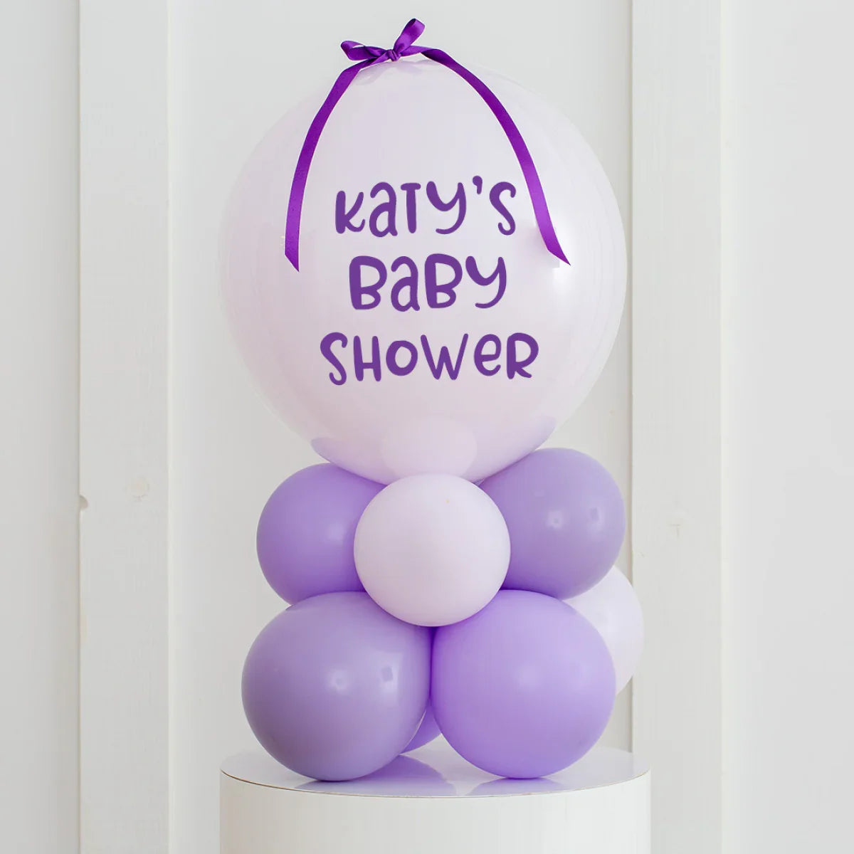Personalized lavender and white air-filled bubble balloon stack for Katy's baby shower