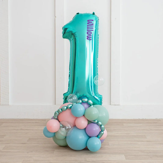 Personalized mermaid number 1 balloon stack with pastel balloons for birthday party decor
