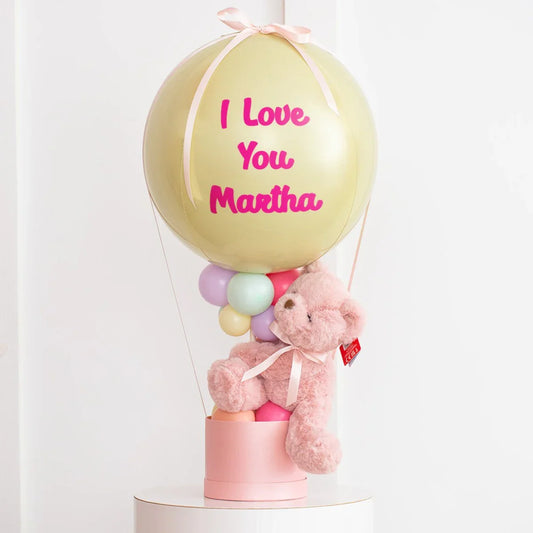 Personalized pastel hot air balloon gift with pink teddy bear and 'I Love You Martha' text