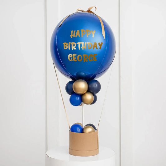 Personalized sapphire blue hot air balloon birthday decoration with gold and navy balloons