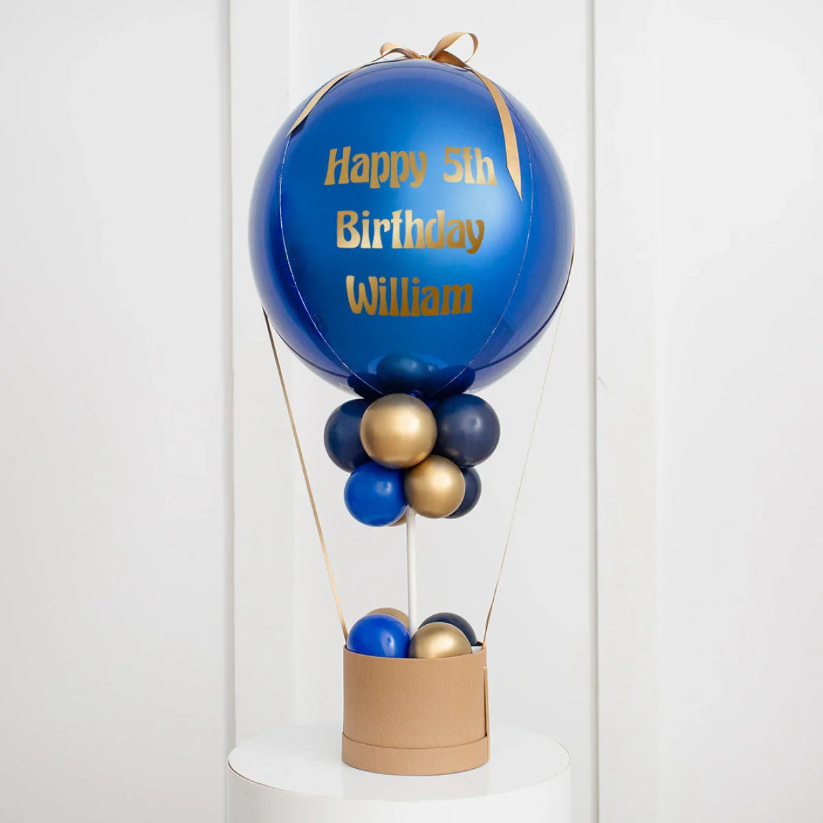 Personalized blue and gold hot air balloon birthday decoration with Happy 5th Birthday William text
