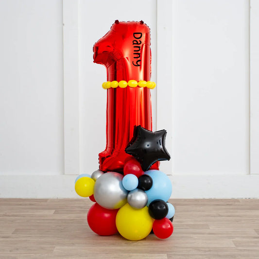 Personalized large red number one balloon with yellow beads and colorful balloon cluster base