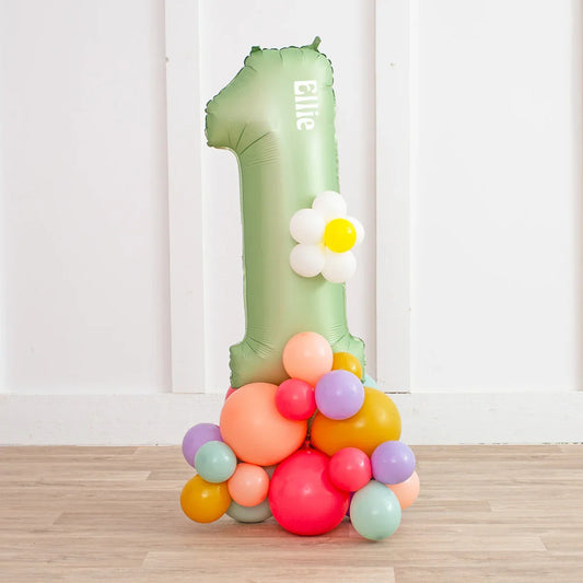 Personalized green number 1 balloon with name Ellie and colorful balloon cluster base