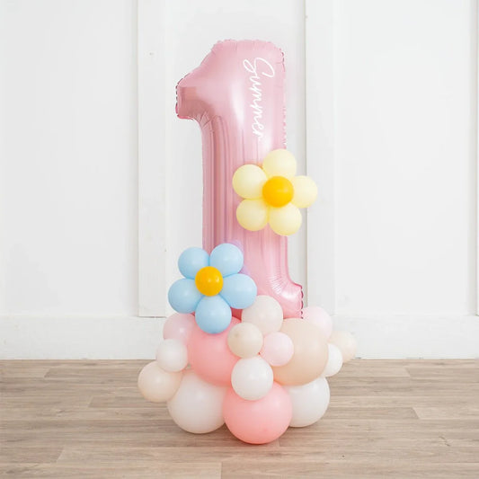 Pink pastel number 1 balloon stack with daisy balloons for first birthday party in Dubai