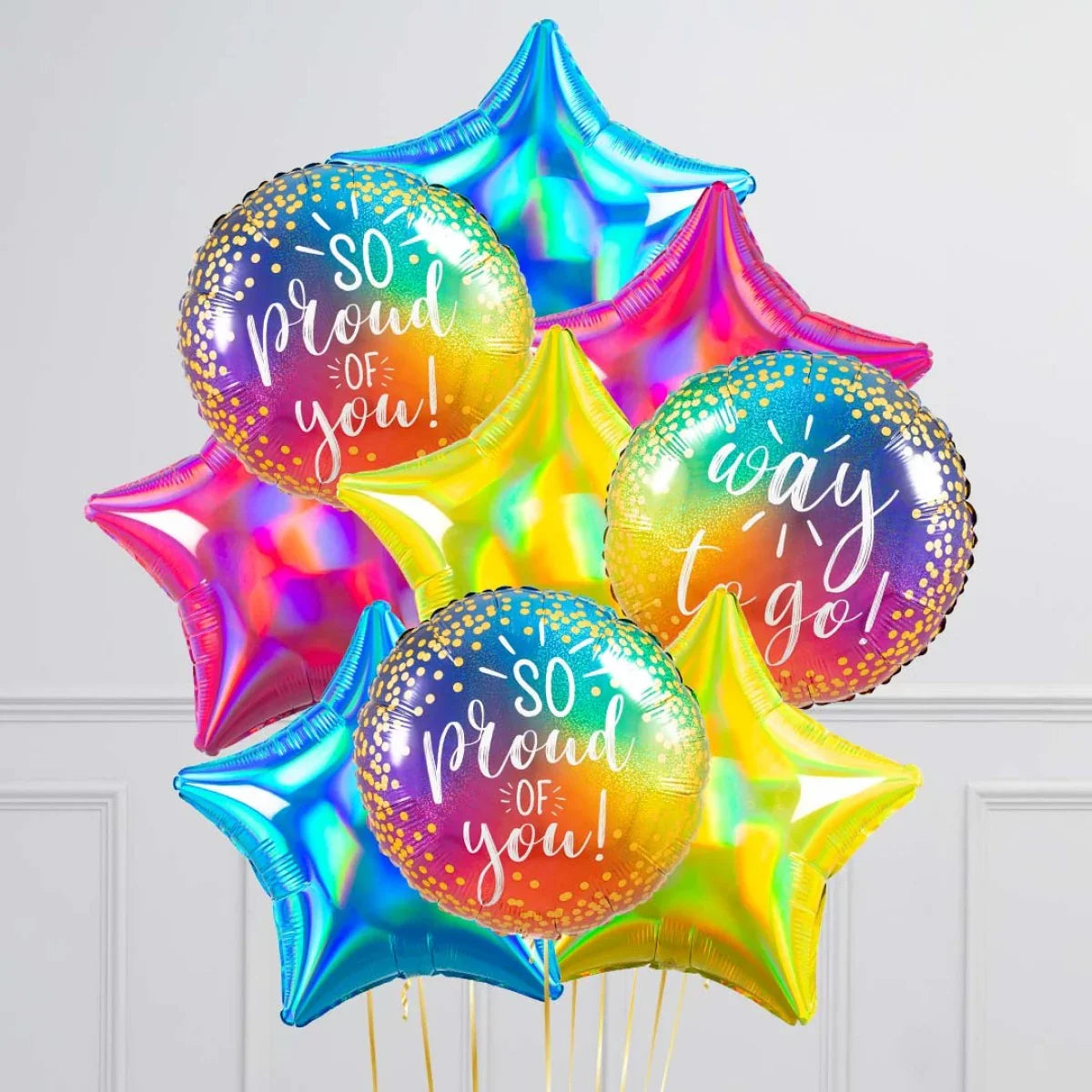 Colorful holographic foil balloons in star and round shapes with messages 'so proud of you' and 'way to go'