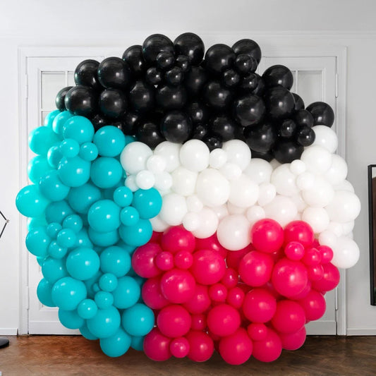 Colorful circle balloon wall in turquoise, black, white and pink for party decoration in Dubai