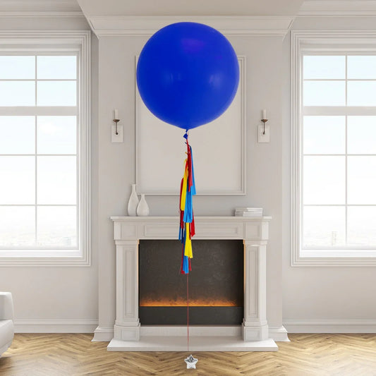 Giant blue helium balloon with colorful superhero tassels in modern Dubai living room