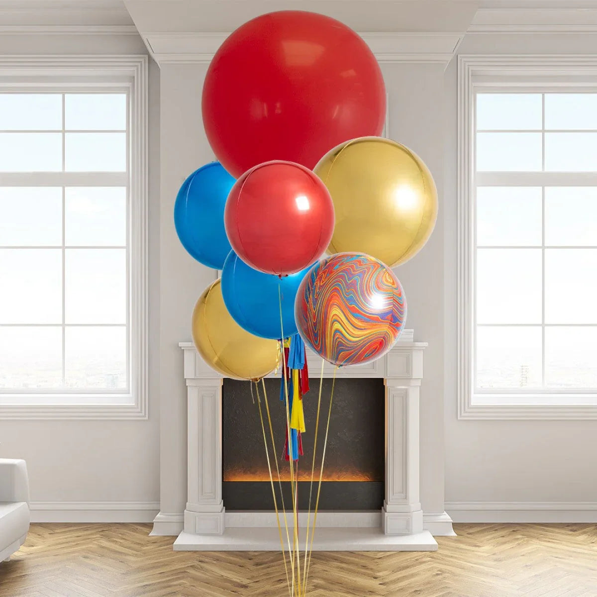 Giant colorful helium balloons in red, blue, yellow, and multicolor swirling design in a modern indoor setting