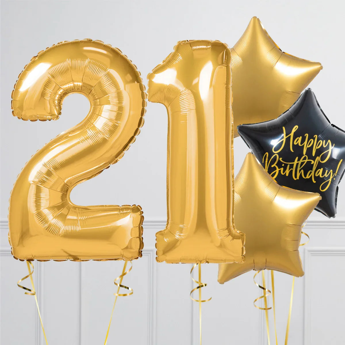Gold foil balloons shaped as number 21 with star-shaped balloons, one black with 'Happy Birthday' text