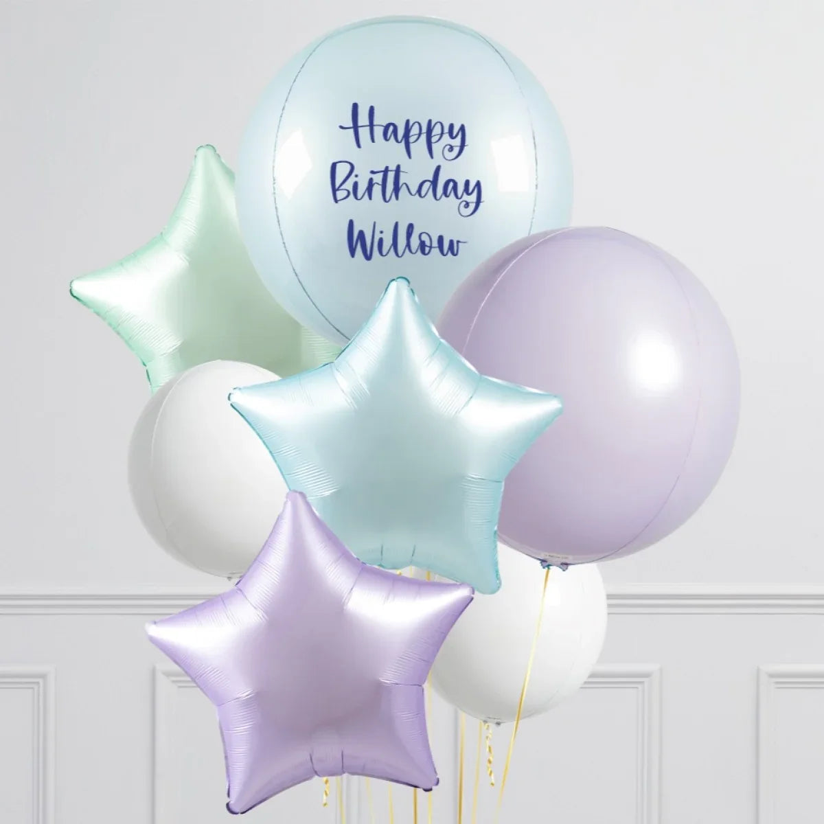 Helium birthday balloon bouquet with star-shaped and round balloons in pastel colors, personalized message