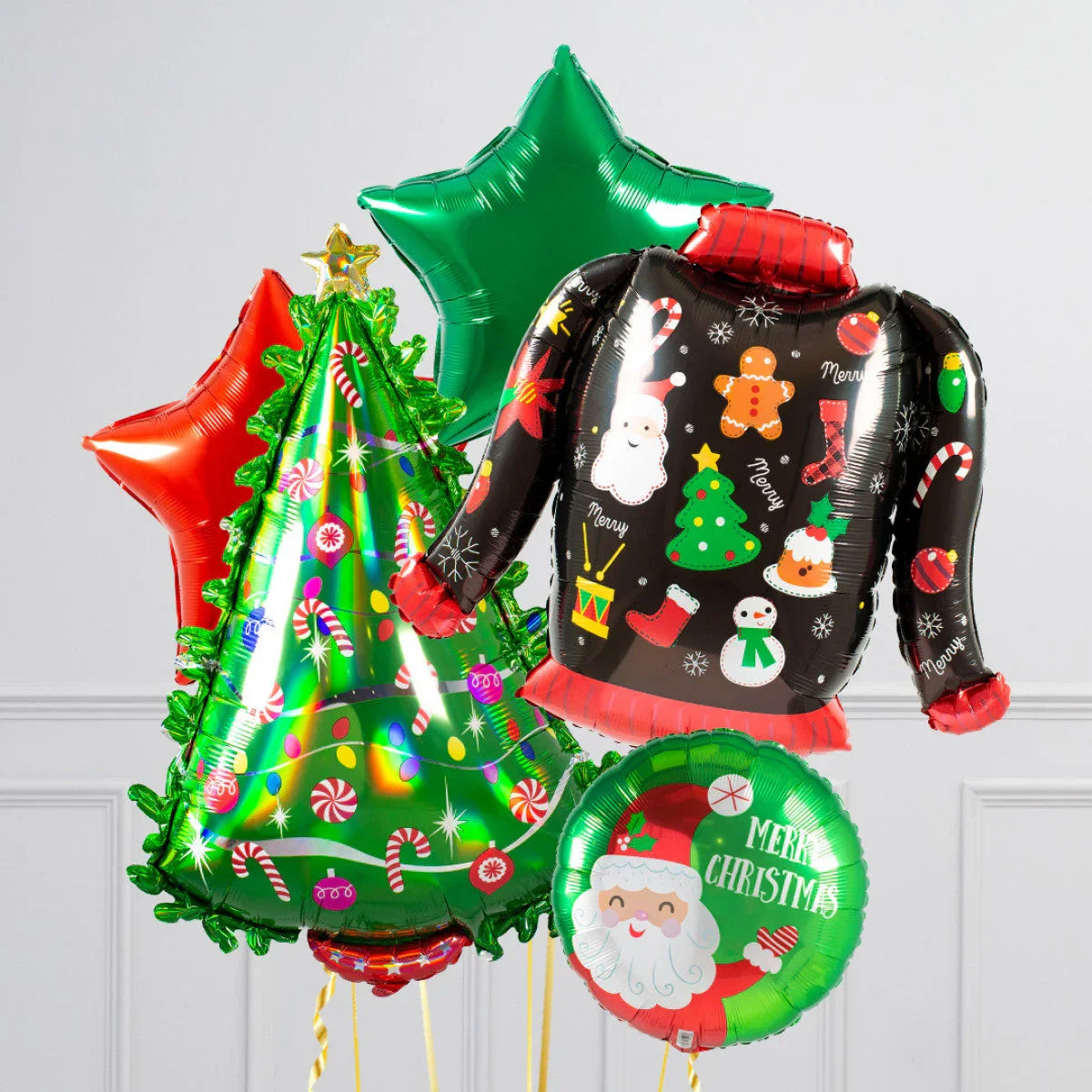Colorful Christmas balloons including decorated tree, festive jumper, Santa face, and star shapes