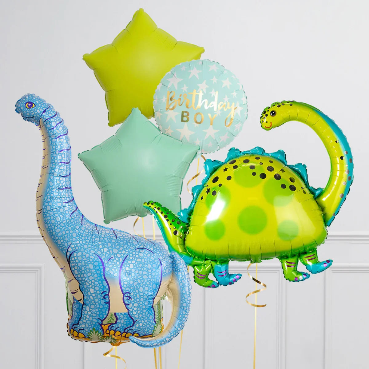 Birthday boy blue and green dinosaur foil balloons with star-shaped balloons for kids' party