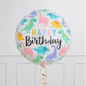 Dinosaur themed happy birthday balloon with colorful cartoon dinosaurs against white wall