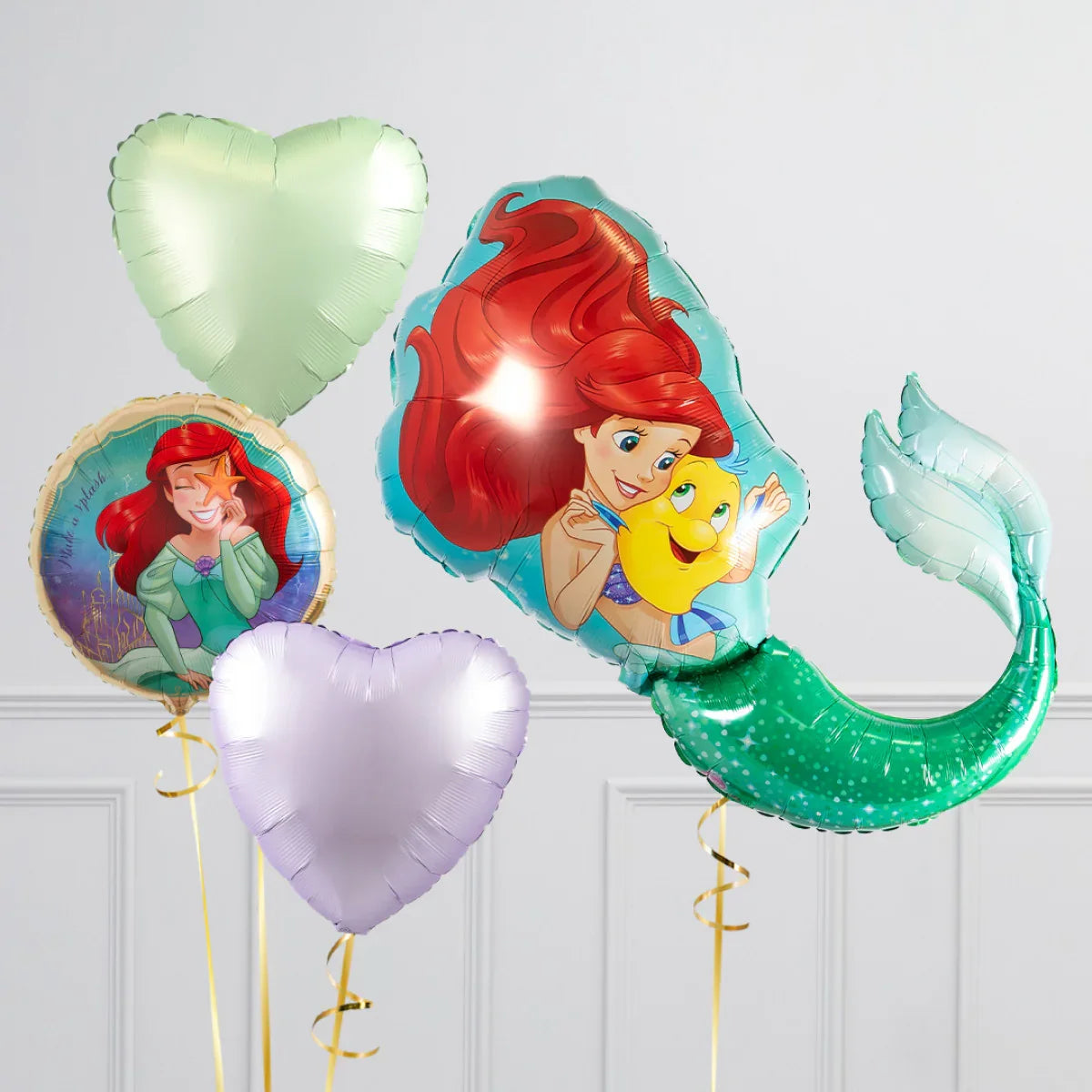 Set of four balloons featuring The Little Mermaid Ariel and purple-green heart-shaped balloons