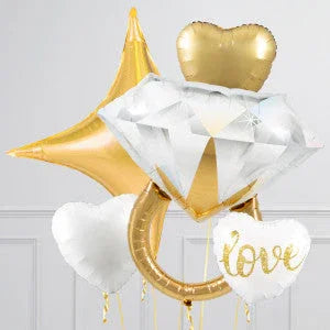 Gold and white engagement balloons shaped like a diamond ring, heart, star and 'love' text.