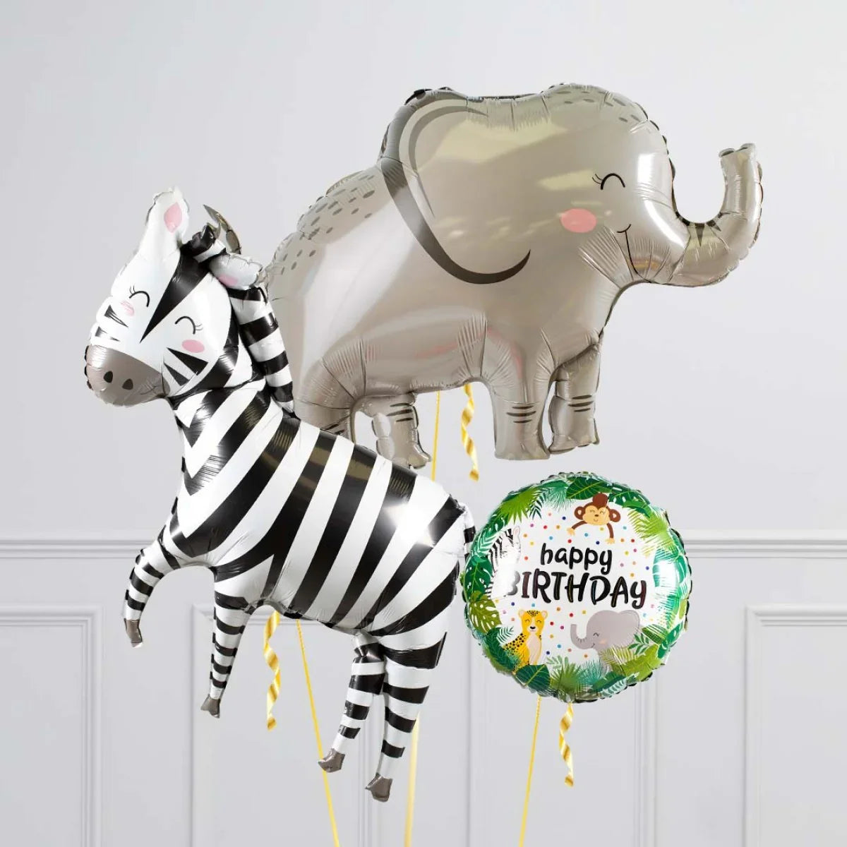 Safari-themed birthday balloons featuring a smiling zebra, elephant, and jungle animal round balloon