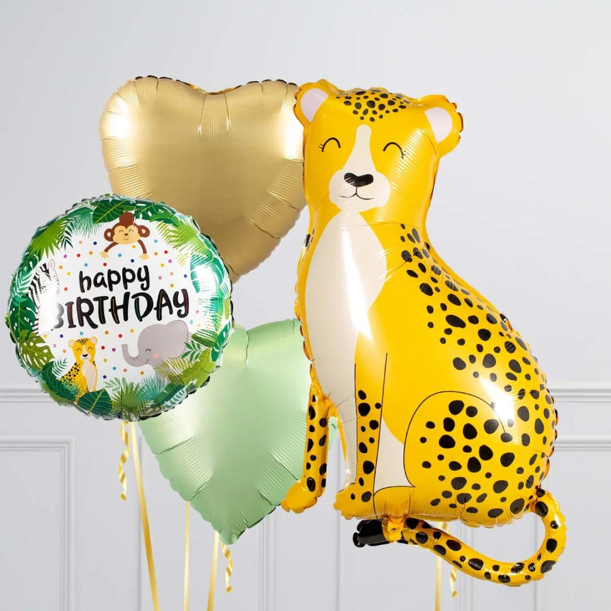 Safari-themed birthday balloons set with a smiling leopard, gold and green heart balloons, and jungle animal print