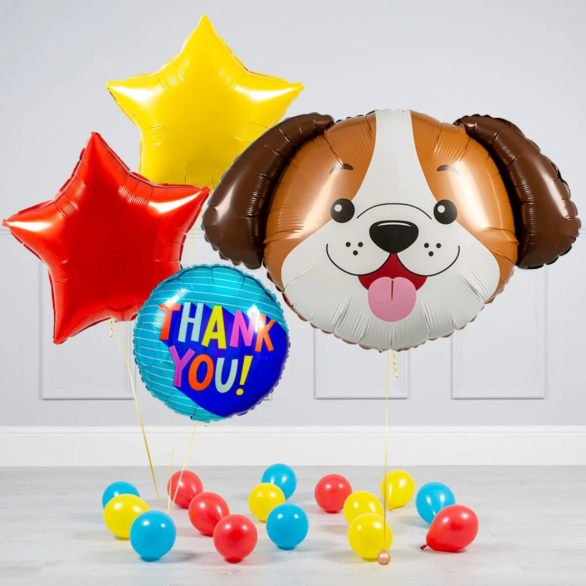 Colorful helium balloons including dog face, red and yellow stars, and round balloon with Thank You text