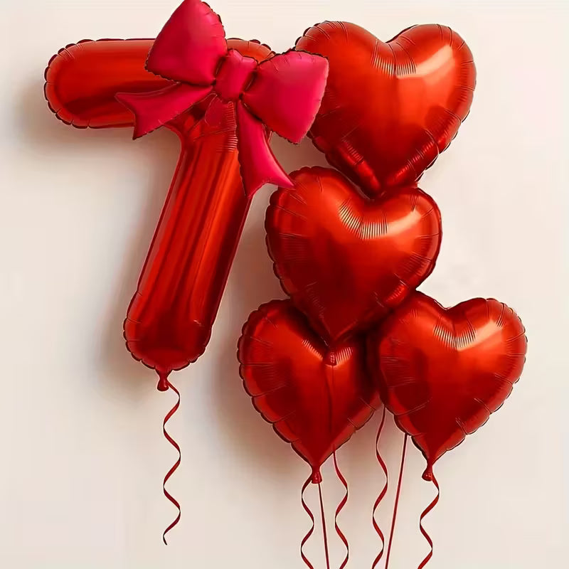 Red number 7 foil balloon with pink bow and five red heart-shaped foil balloons for party decoration