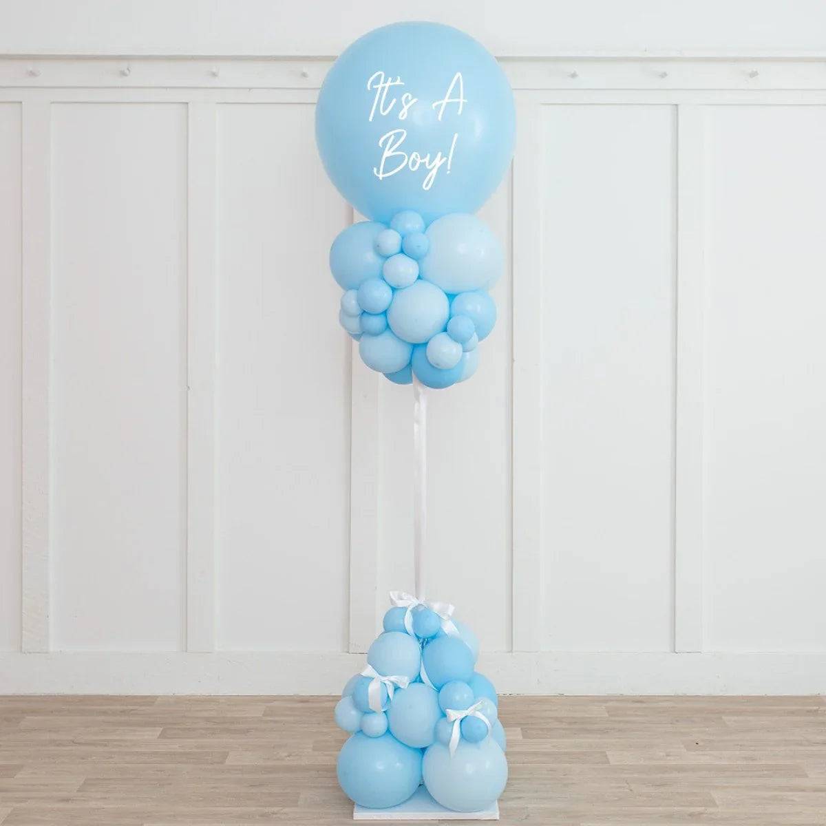 Baby blue balloon pillar with 'It's A Boy!' text, baby shower party decoration