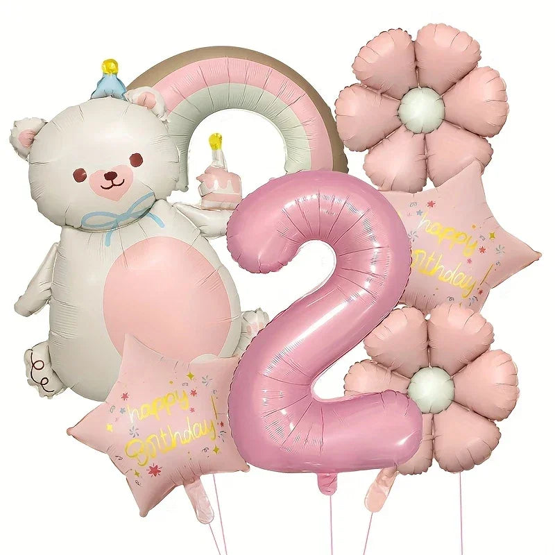 Pink and white bear-shaped foil balloon holding cake, pink number 2 balloon, flowers, and Happy Birthday star balloons