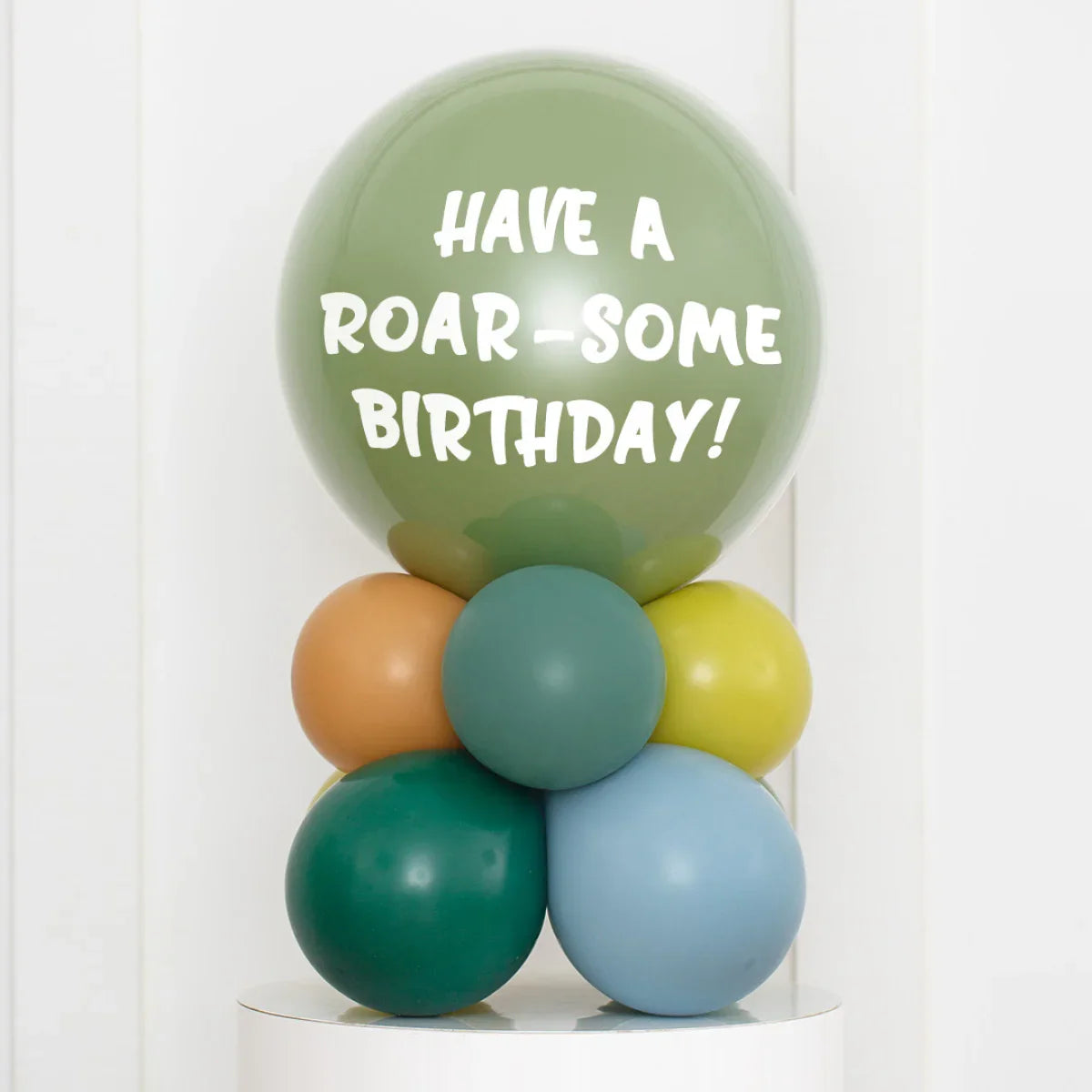 Personalised dinosaur-themed green birthday balloon stack with Have a Roar-some Birthday text