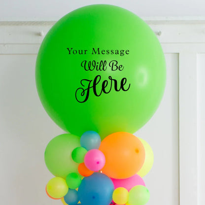 Large green balloon with customizable message text above colorful assorted smaller balloons on white background