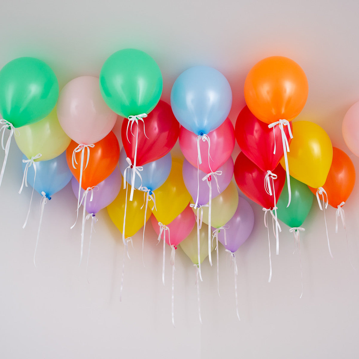 Brighten Your Celebration with Rainbow Bright Biodegradable Latex Ceiling Balloons