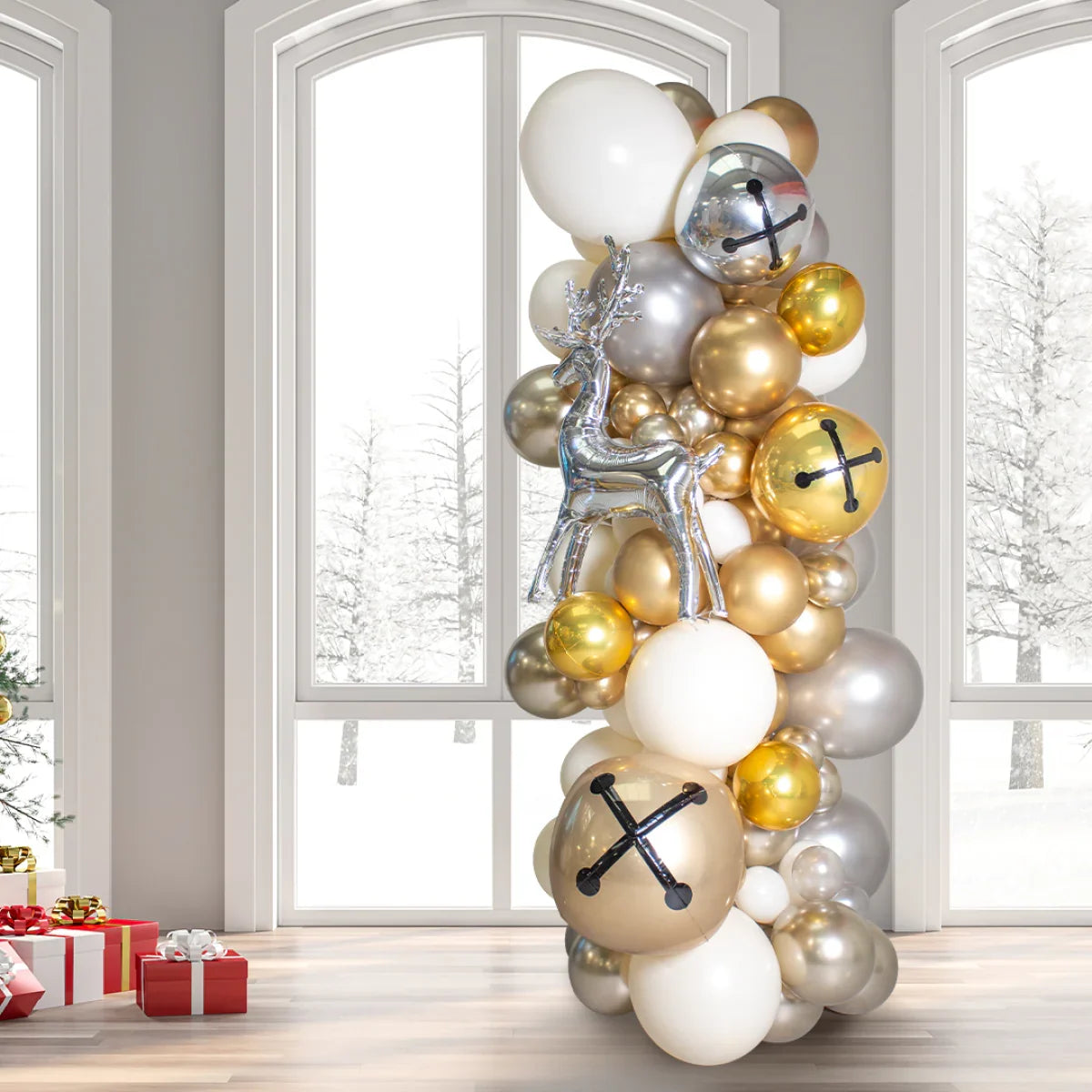 Elegant Christmas balloon pillar with gold, silver, white balloons and a silver reindeer balloon in a festive room
