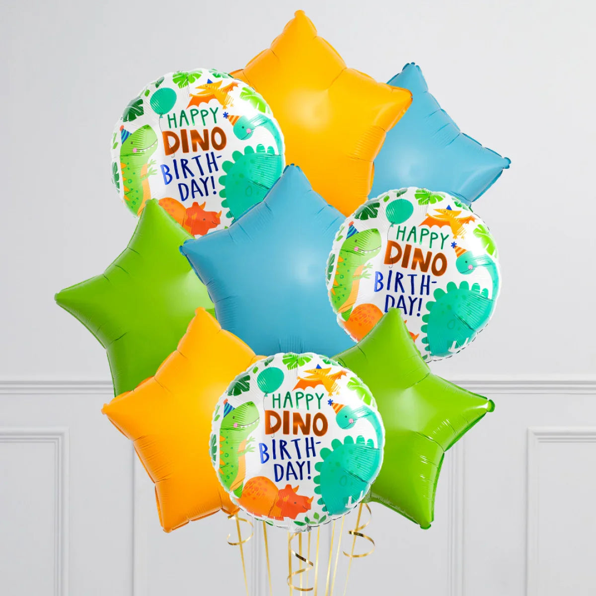 Colorful birthday balloons with dinosaur prints and star-shaped balloons in orange, blue, and green