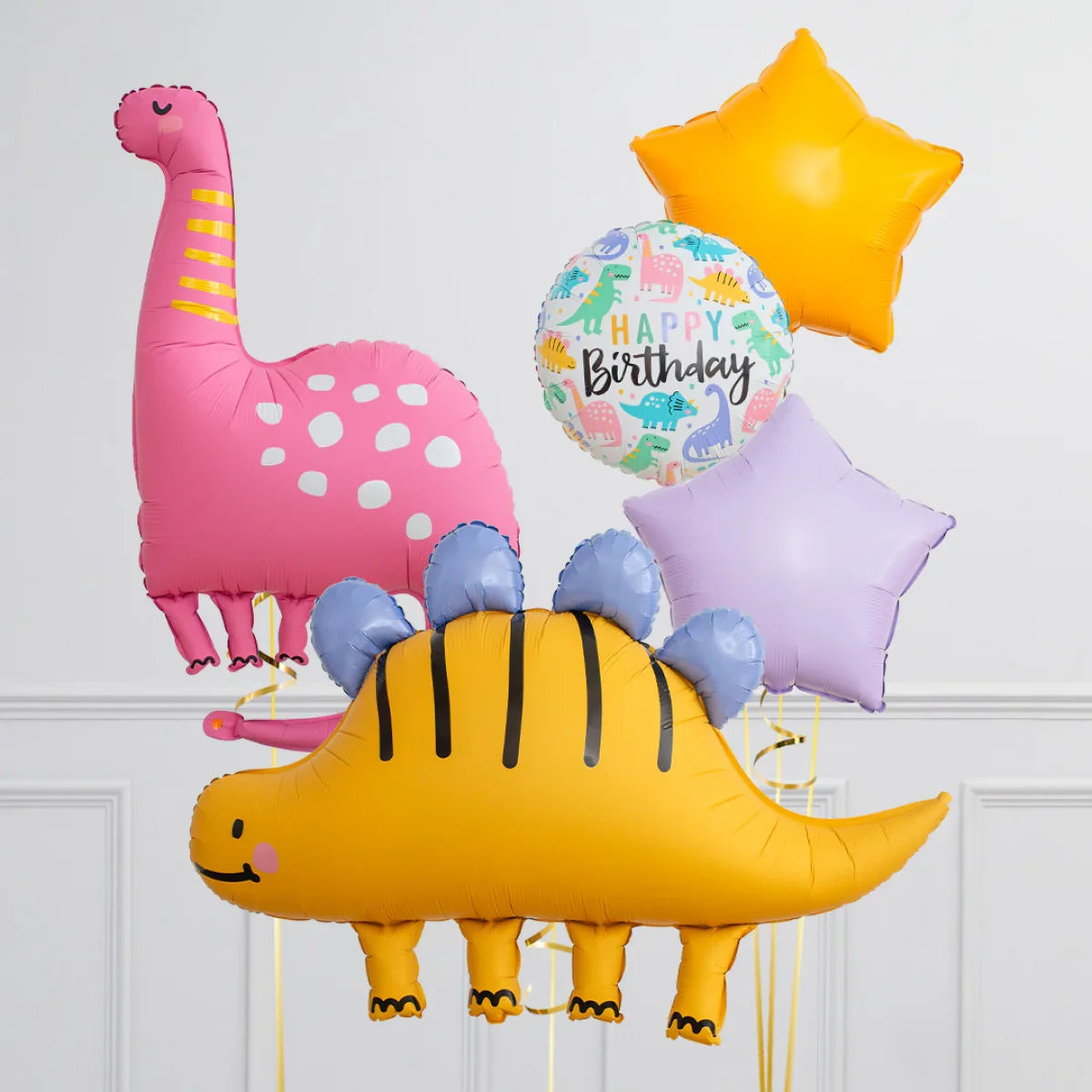 Colorful dinosaur and star-shaped birthday balloons with Happy Birthday message on white background